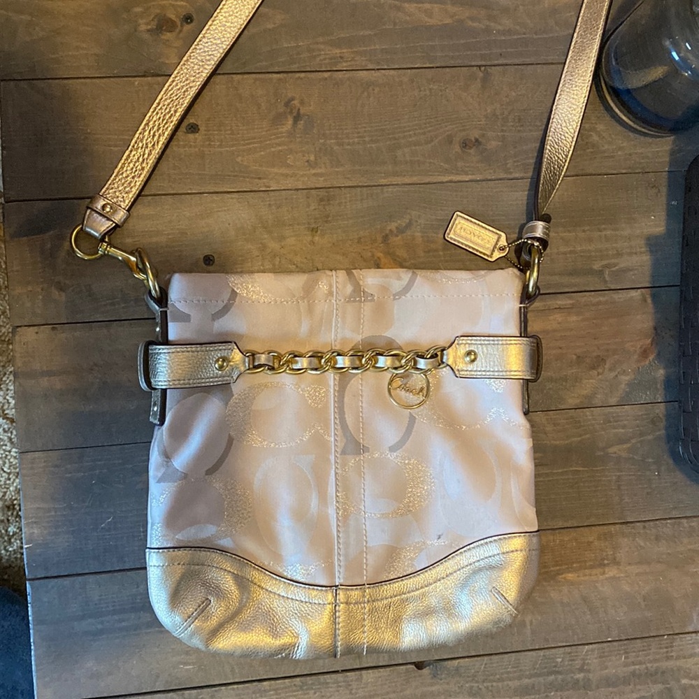 Coach purse. Cream/gold in color . Approximately 11” x 11”.